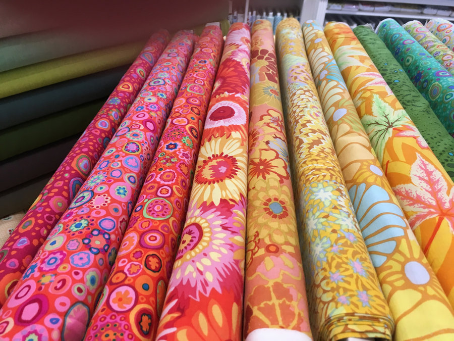 Colourful bolts of quilting fabric
